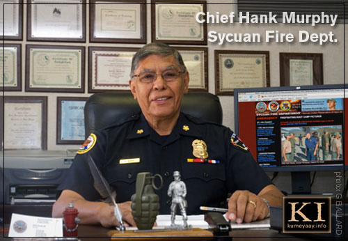 HENRY R. MURPHY Seated at Command Desk